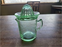 Green glass measuring/juicer