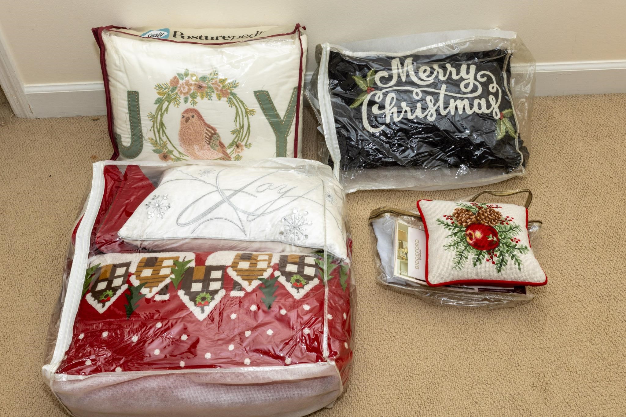 Eight winter and Christmas throw pillows.