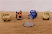 Four 1994 Micro Machine toy trucks