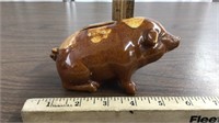 Brown porcelain sitting pig bank