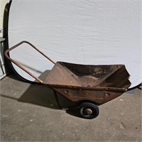 Old metal wheel barrel