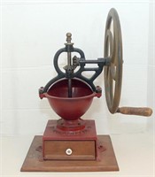Large wheel coffee grinder marked "Goldberg