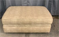 OVER-STUFFED OTTOMAN ON CASTERS/TAN