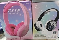 2 headsets new in open box.  1 is a pink glitter