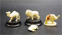 Vintage ivory lion and camel on wooden stands