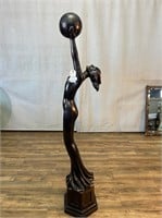 Composite Art Deco Woman Holding Globe Statue