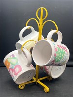 Yellow metal mid century mug rack & mugs