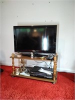 Toshiba flat screen TV  stand and contents
