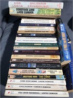 Box full of Louis l’Amour western books