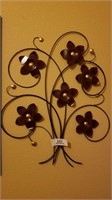 ^ Metal floral wall hanging 15” X20”.