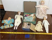 Porcelain dolls, doll parts, kid-bodied doll made