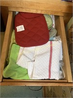 Small drawer of towels and hot pads