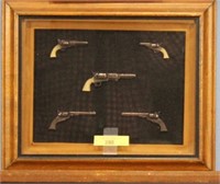 Turner Framed Wall Decor Of Pistols