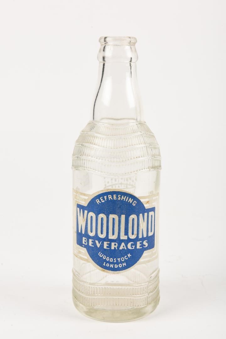 WOODLOND BEVERAGES 10 OZS. EMBOSSED BOTTLE