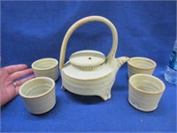 signed pottery teapot & 4 smaller mugs (matching)