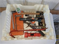 Plastic storage tray with assorted tools