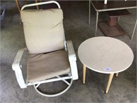 Small table and swivel metal chair