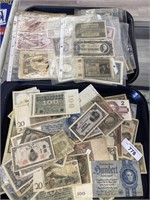 2 trays of foreign paper money.