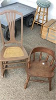 Mid size wood rocking chair with caned seat and