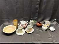 Teapot, glass bowls, cups and saucers, creamers, s