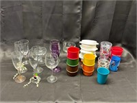 10 stemware glasses, 10 plastic cups, 4 Tupperware