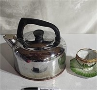 Tea kettle, tea cup and saucer