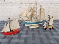 Three decorative fabric-sailed wooden ships
