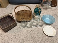 Glass bowl, decor, and wicker baskets