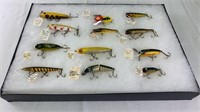 (12) Vintage fishing lures in showcase