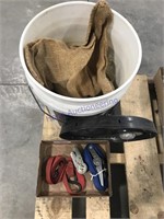 Ratchet strap, bucket, gunney sack