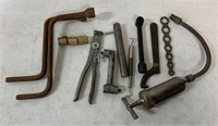 tools + parts including grease gun and wrenches