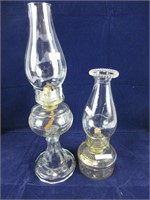 TWO CLEAR GLASS BASE OIL LAMPS