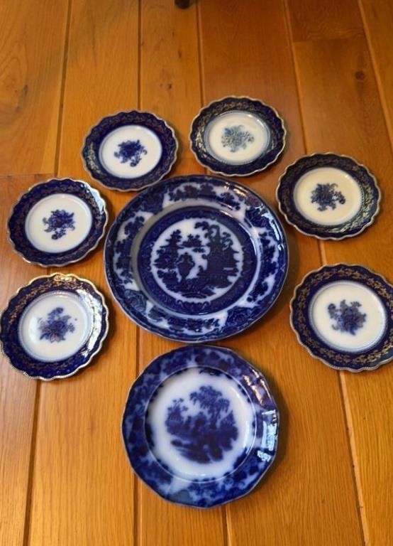Eight antique flow blue plates, includes one 9