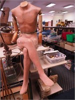 Male seated mannequin with crossed legs,