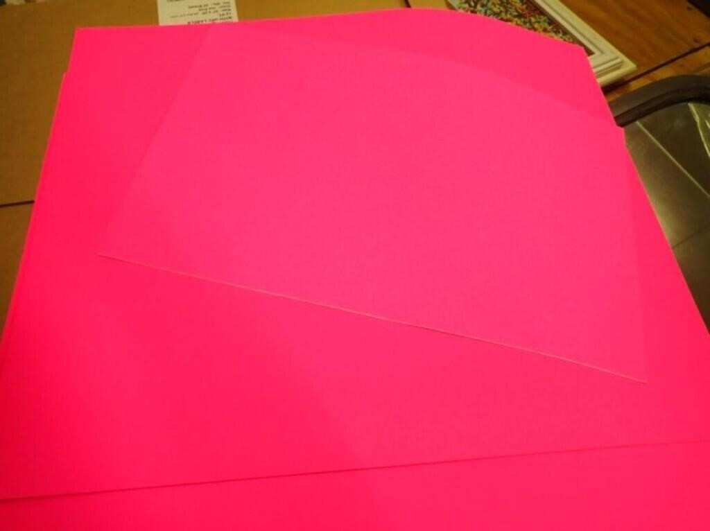 Several Sheets Of Pink Poster Board