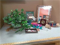 Unused picture frames, buttons, artificial plant