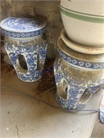 Oriental porcelain plant stands on back porch