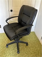 Black office chair on rollers