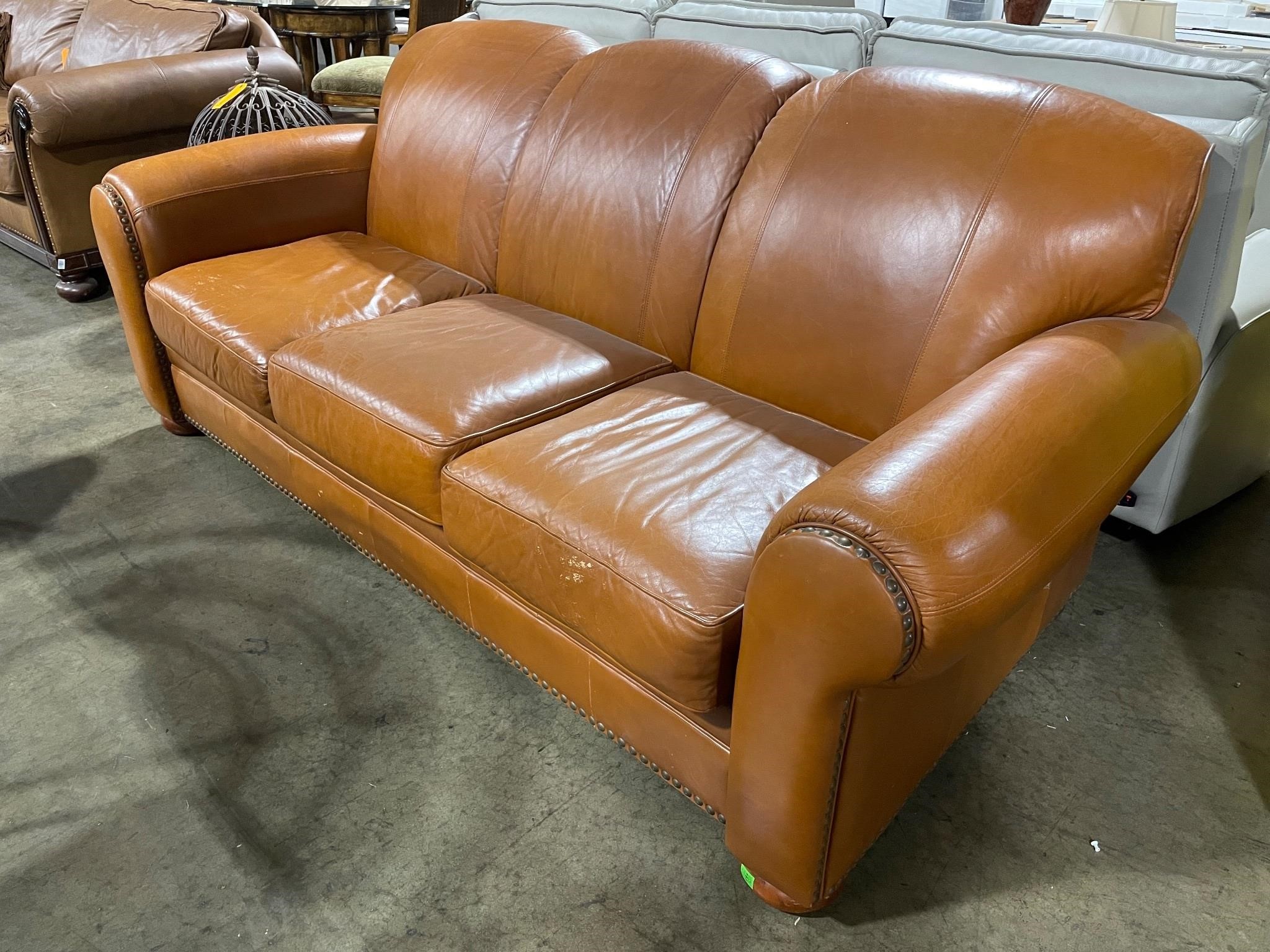 Distressed brown leather sofa