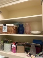 Contents of two shelves in laundry room with