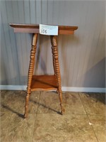 Wooden bible table with turned legs.