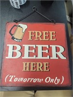 Free beer here tomorrow only metal sign