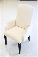 UPHOLSTERED ARM CHAIR WITH BLACK LEGS