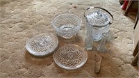 Decorative glass bowl, glass plates, tongs, glass