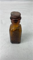 Vintage amber glass poison bottle