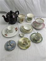 Assortment of floral tea, cups, and teapot