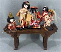 Oriental Figurines on Display Shelf