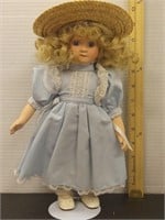 Porcelain doll  11in tall