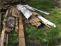 3 - Piles of used lumber & siding.