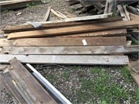 Pile of used 2"x8" dimension lumber.